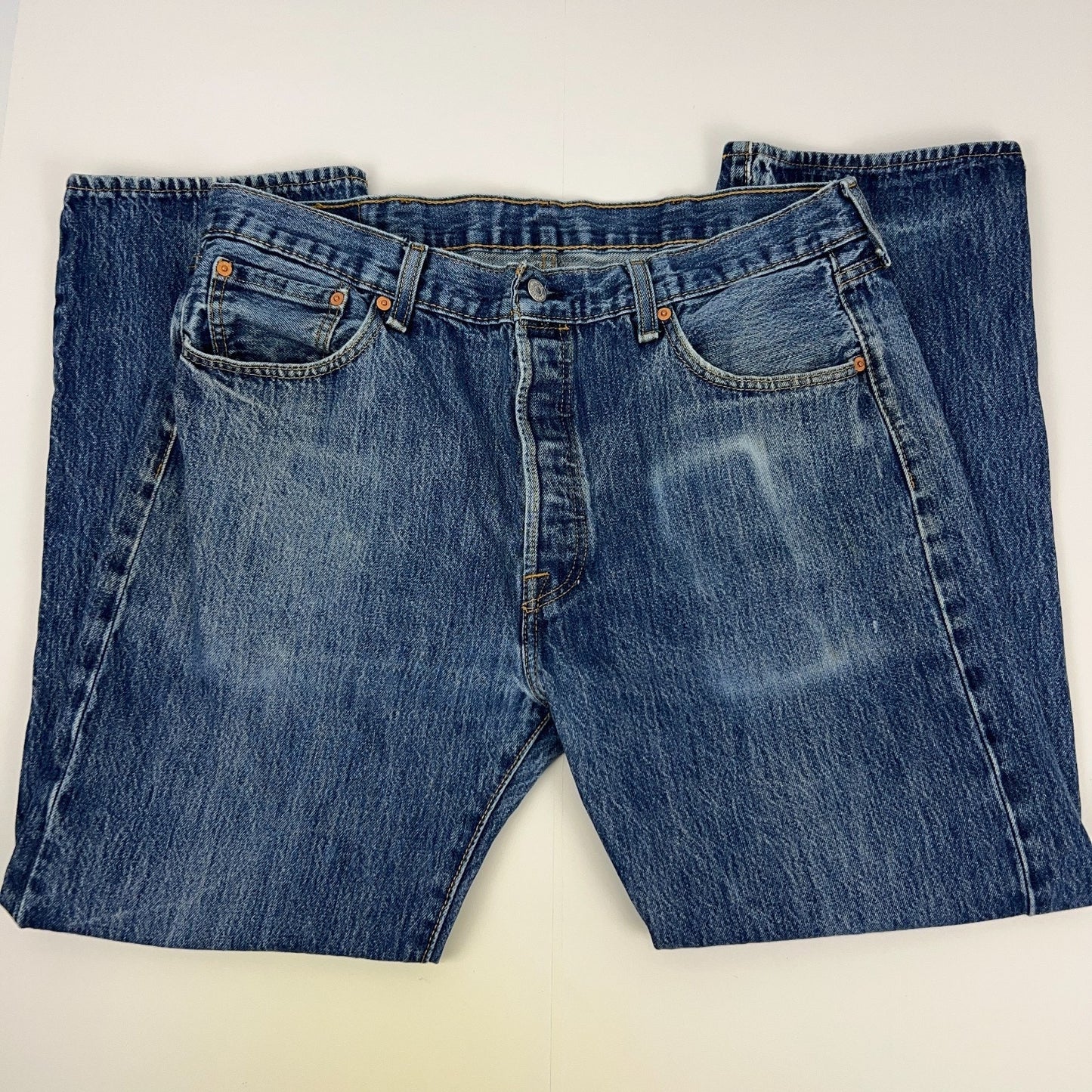 Levis 501 Blue Denim Jeans in Size 32 with Front View Showing Distressed Wash and Classic Logo