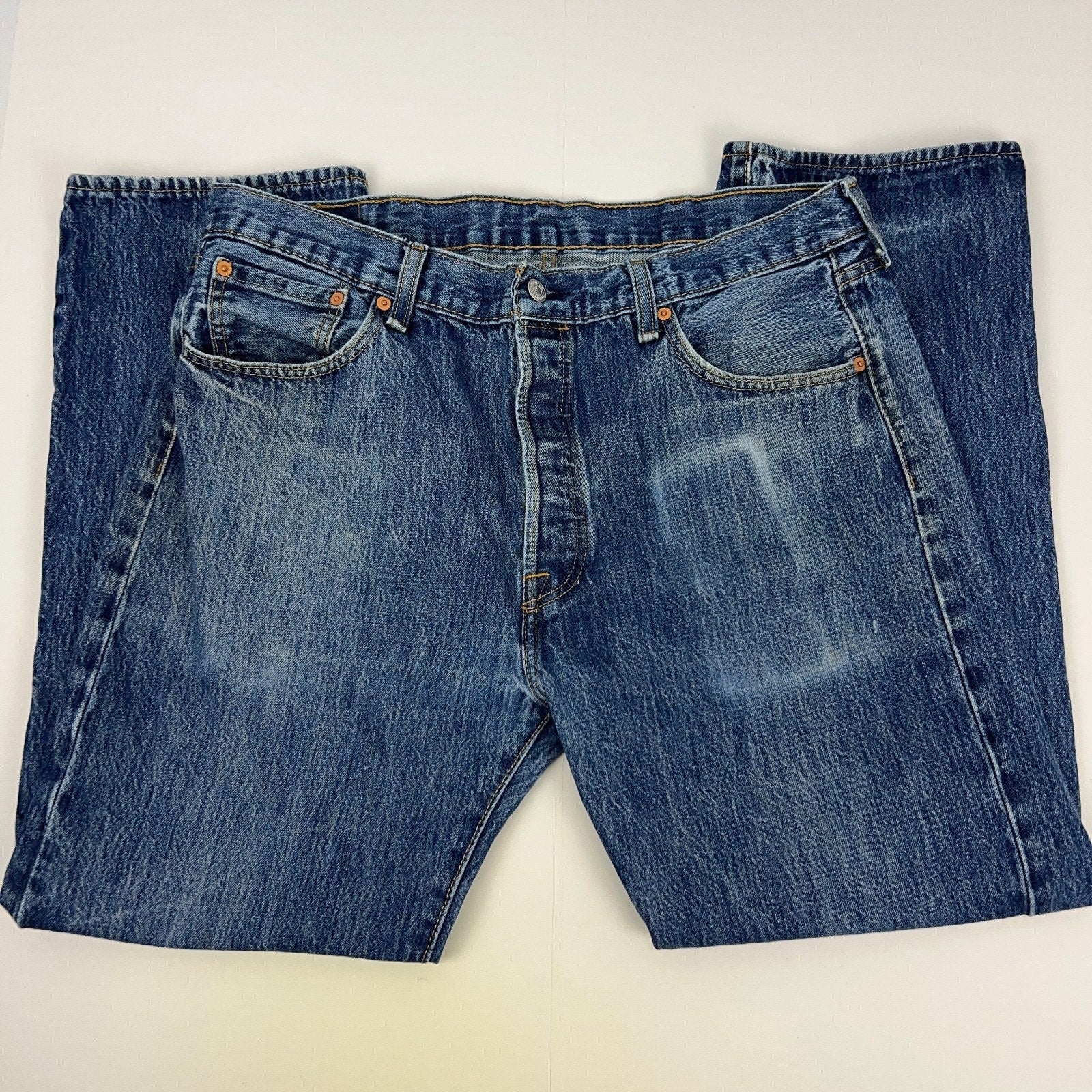 Levis 501 Blue Denim Jeans in Size 32 with Front View Showing Distressed Wash and Classic Logo