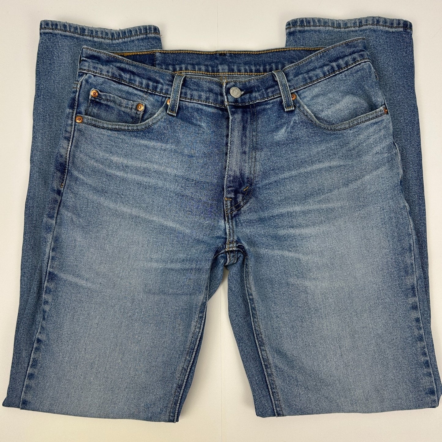 Levi's 541 blue jeans in front view, featuring classic fit with five pockets and logo on the back waistband