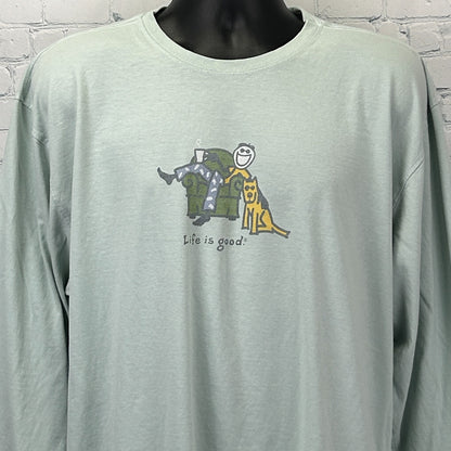Front view of light green Life Is Good T Shirt with couch graphic and smiling character