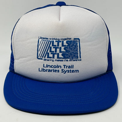 Front view of a vintage blue hat with Lincoln Trail Libraries System logo, featuring Illinois details