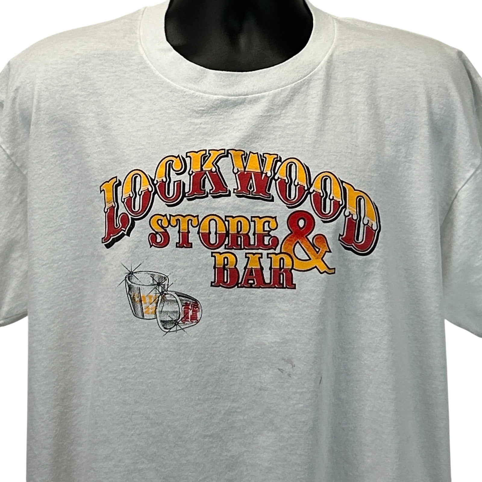 Vintage gray T-shirt featuring Lockwood Store and Bar logo with colorful graphic on the front