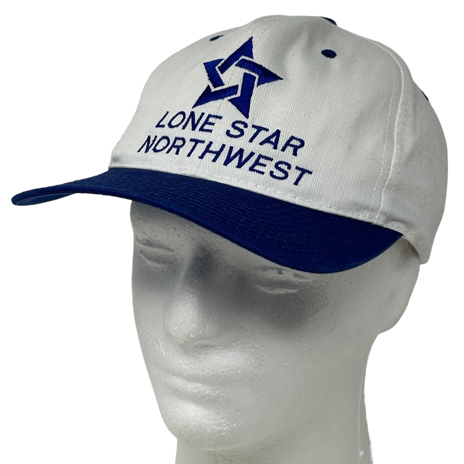 Vintage white baseball cap with blue brim, featuring Lone Star Northwest logo on the front