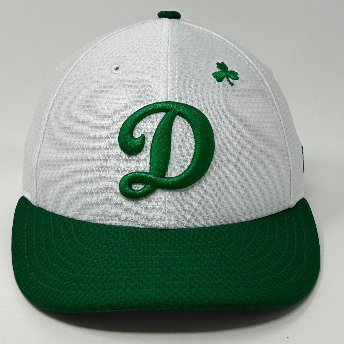 Front view of New Era Los Angeles Dodgers Hat in white and green with embroidered D logo and clover detail