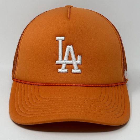 Front view of orange ’47 Los Angeles Dodgers cap with white LA logo and mesh back design