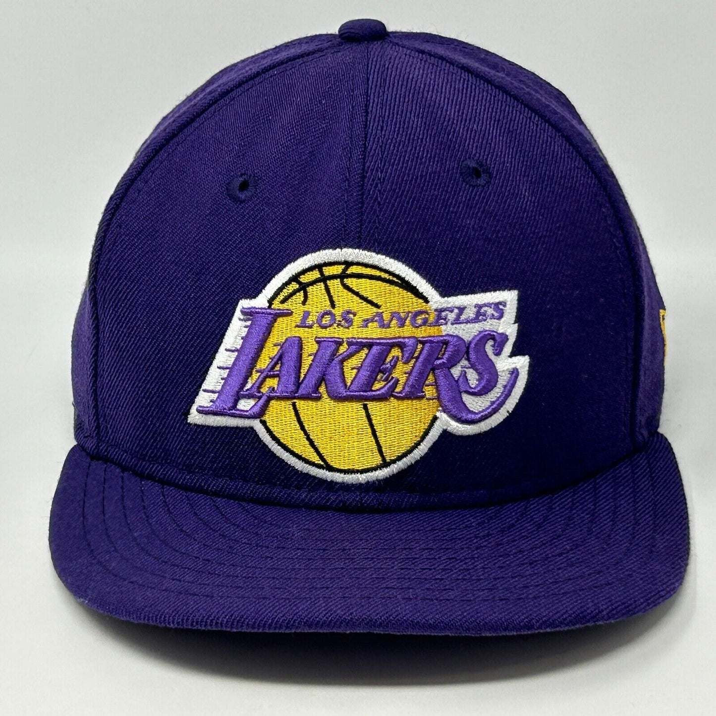 Front view of a New Era Los Angeles Lakers purple hat with embroidered logo