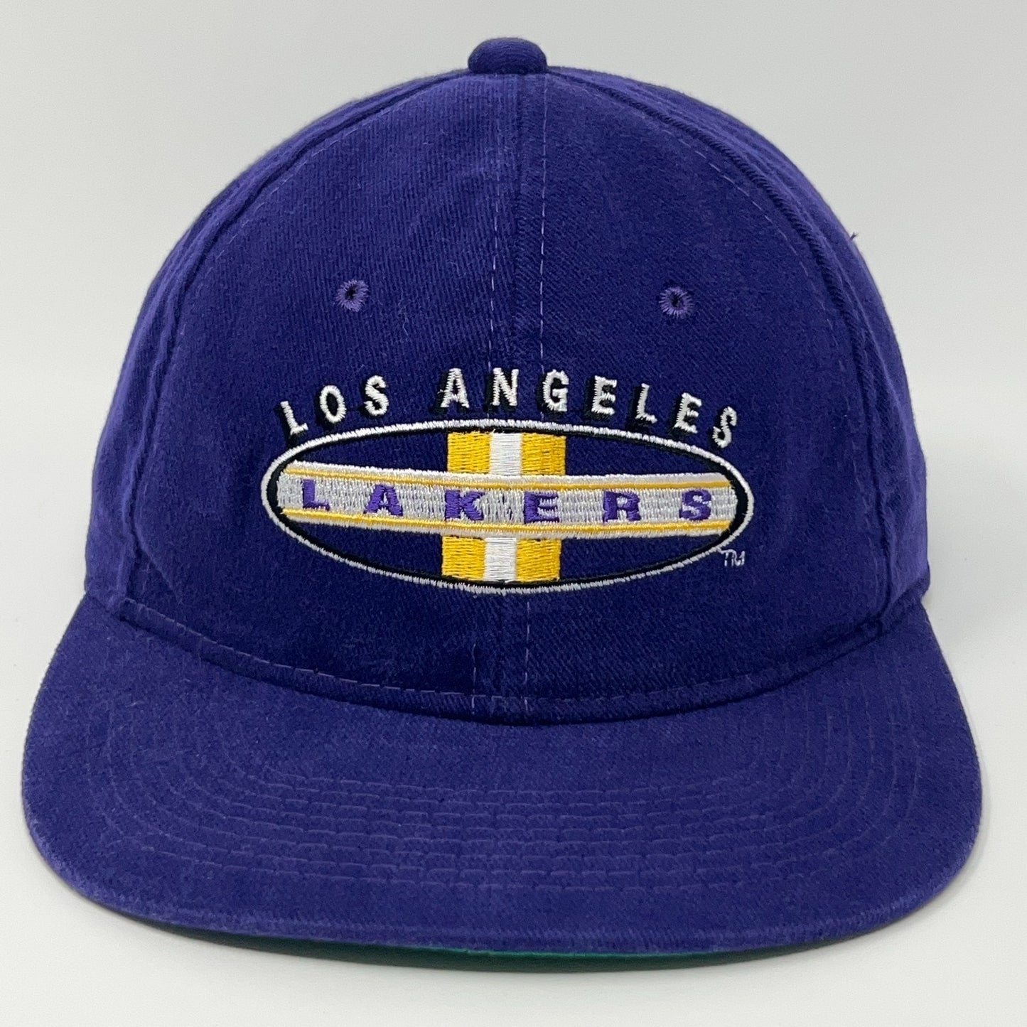 Los Angeles Lakers purple baseball cap featuring embroidered logo on the front