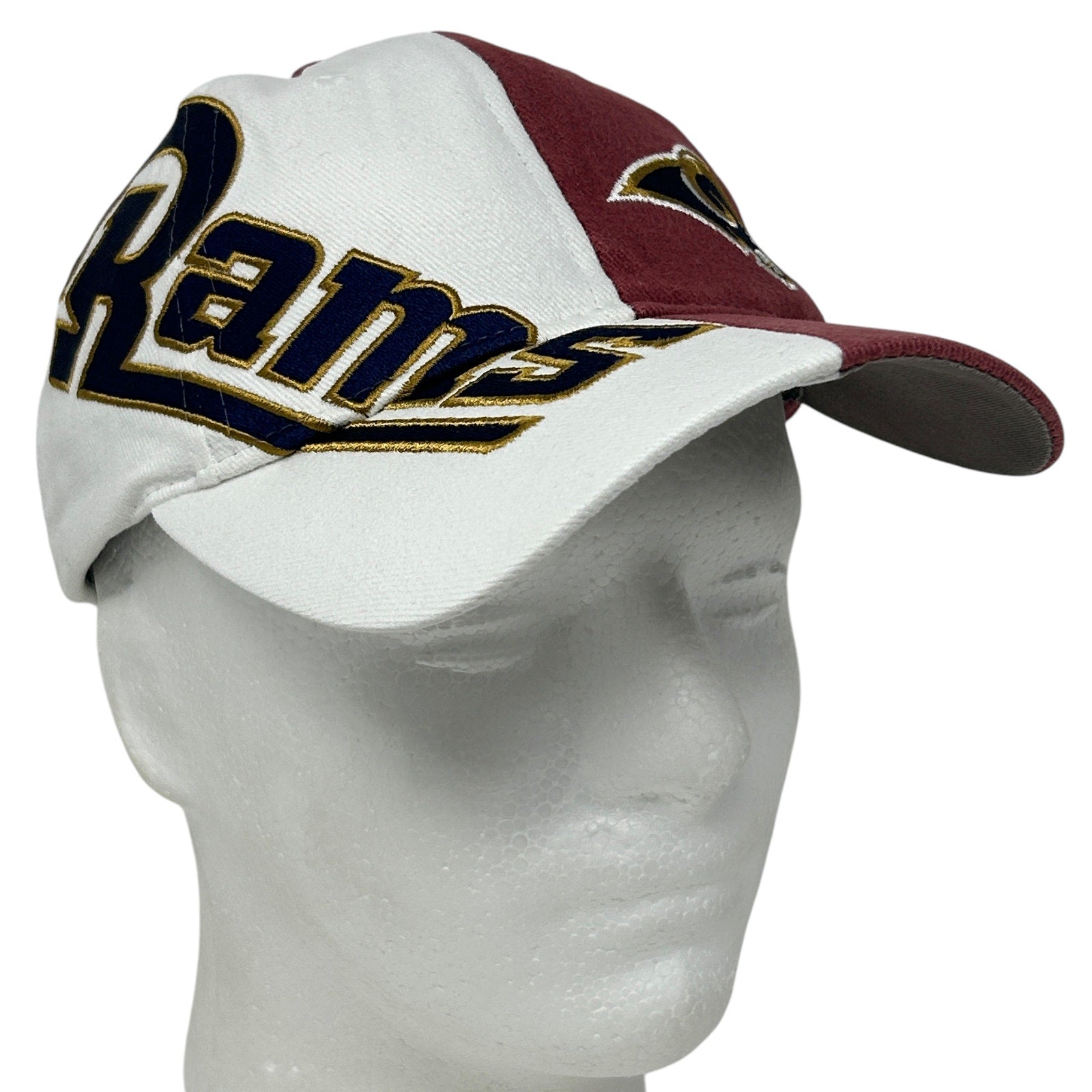 Los Angeles Rams cap in white and maroon, featuring bold Rams logo on the front, side view