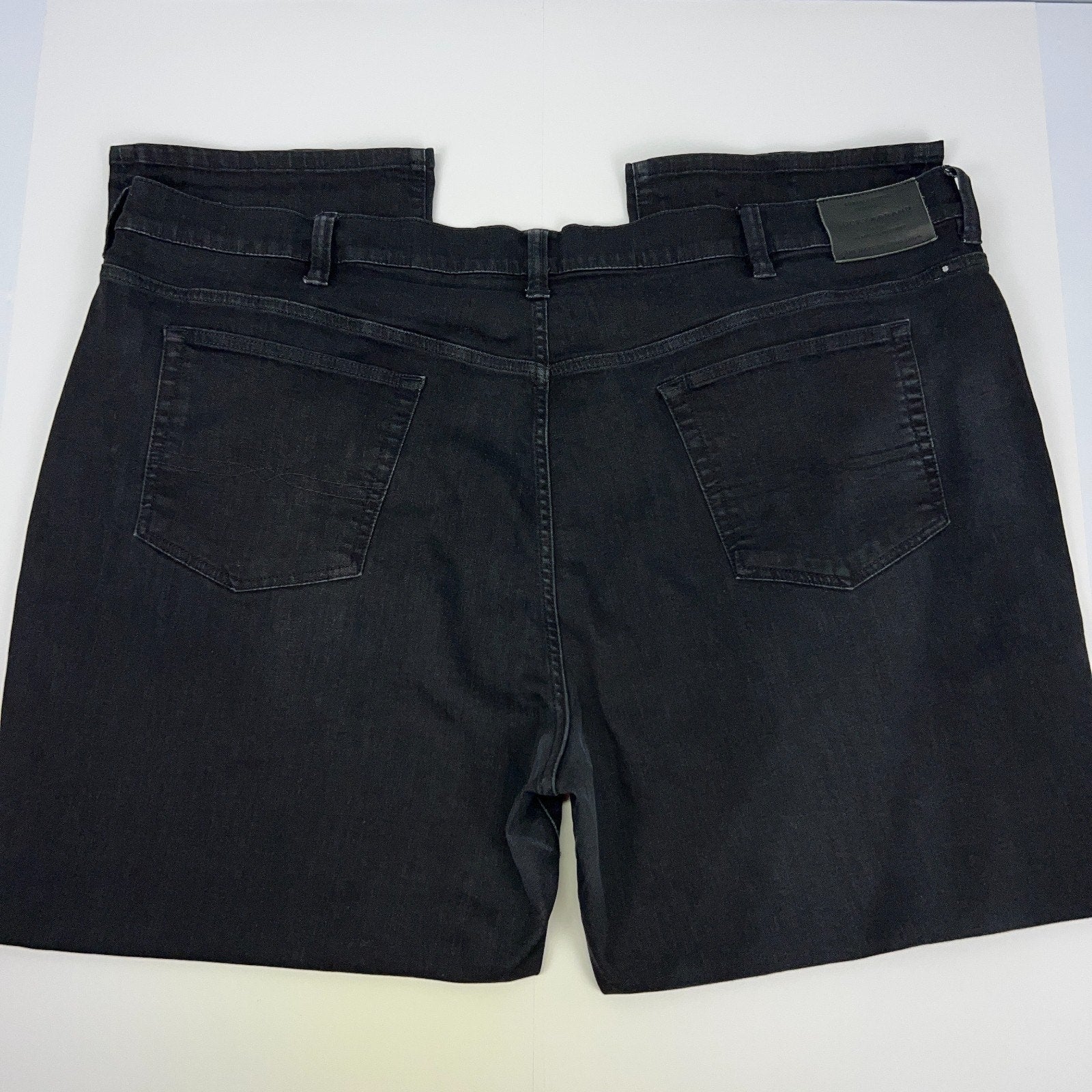 Lucky Brand black denim jeans with two back pockets and logo patch