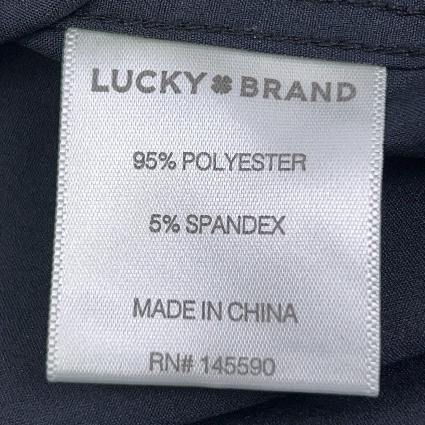 Lucky Brand long sleeve shirt in dark blue, 95% polyester and 5% spandex fabric close-up