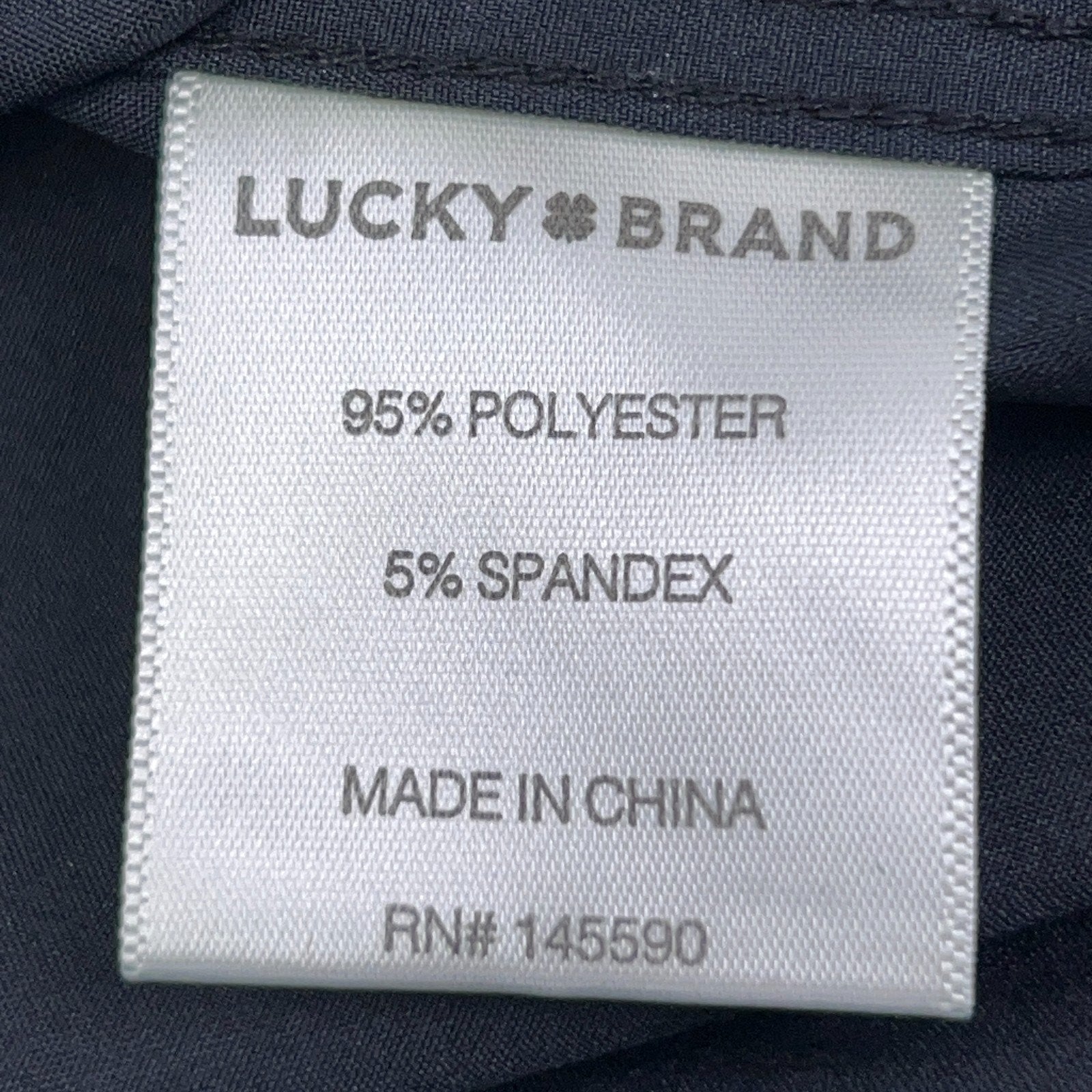 Lucky Brand long sleeve shirt in dark blue, 95% polyester and 5% spandex fabric close-up