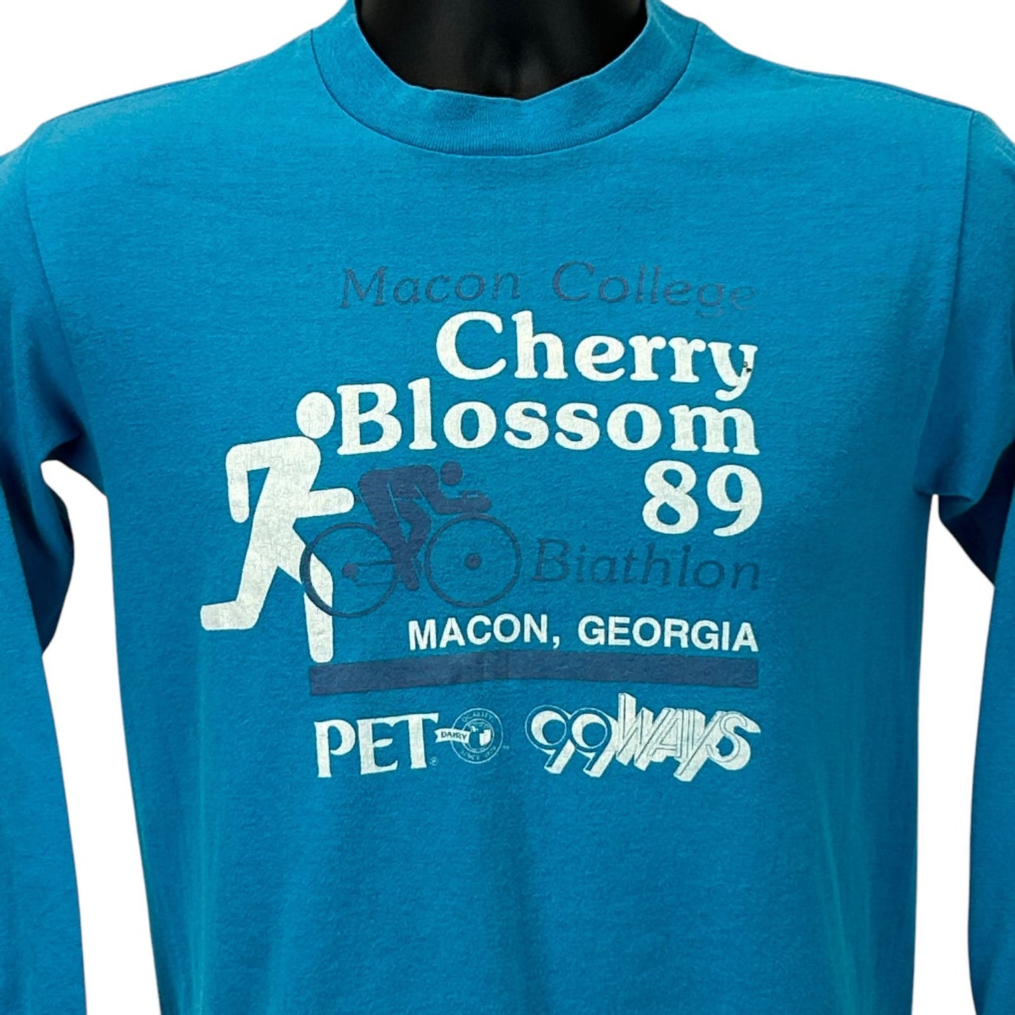 Vintage Macon Georgia Cherry Blossom 89 T-Shirt in turquoise, featuring a running graphic on the front.