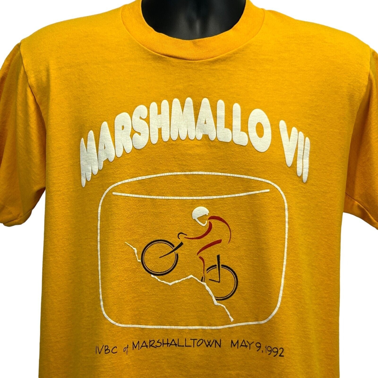 Vintage yellow Marshalltown T-shirt featuring a bike graphic and text in front view, size medium