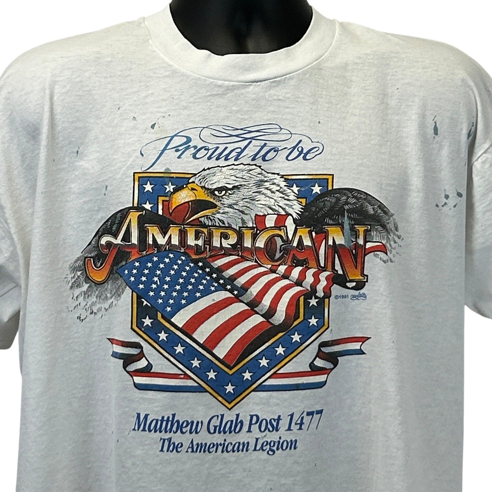 Front view of a vintage American Legion T-Shirt in white with eagle and flag design, size large