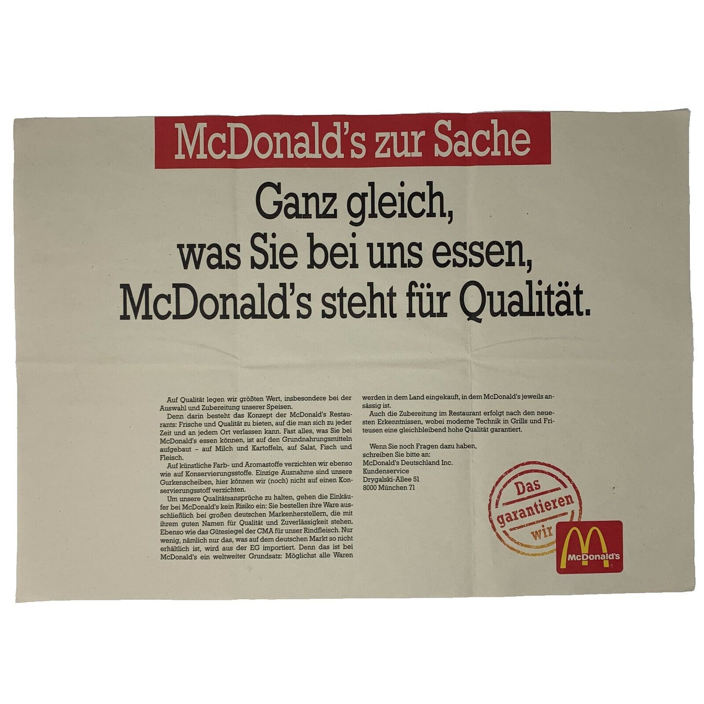 McDonald's promotional banner in beige and red featuring a quality message and logo