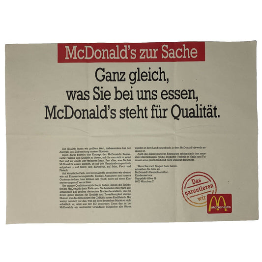 McDonald's promotional banner in beige and red featuring a quality message and logo