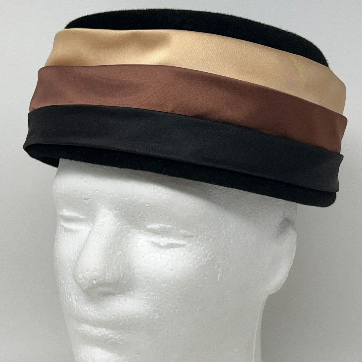 Merrimac vintage satin-striped hat in black, brown, and beige colors with a classic design