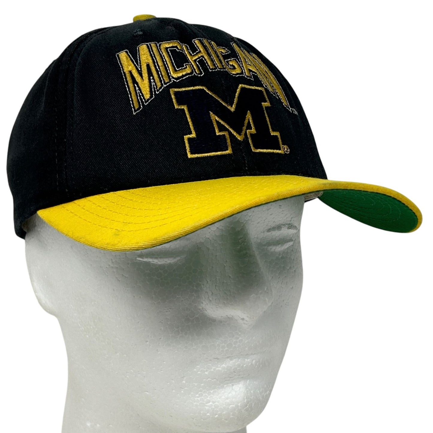 Black and yellow Michigan Wolverines cap with front logo and contrasting visor for sports fans