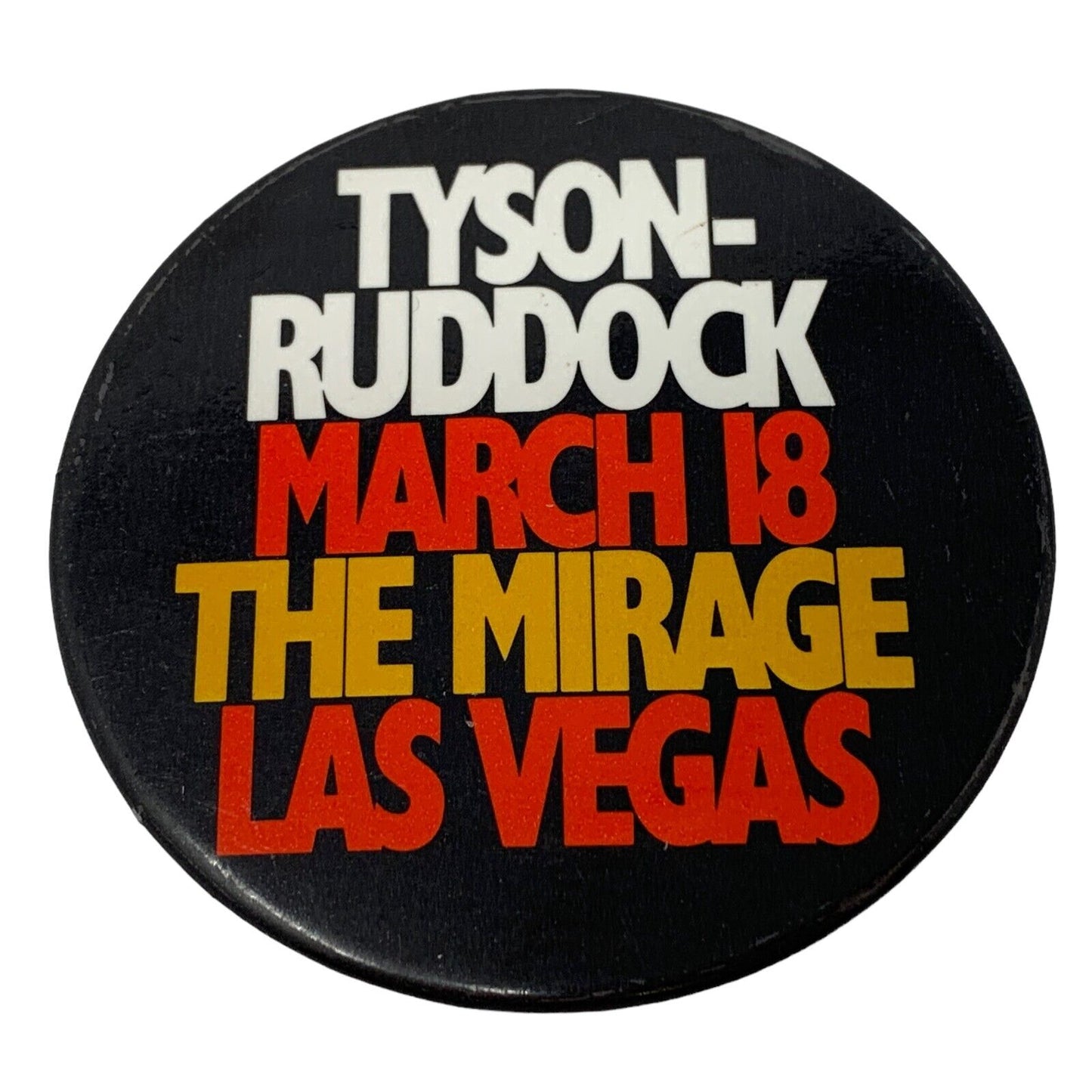 Black button with bold text reading Mike Tyson Ruddock March 18 The Mirage Las Vegas for boxing fans