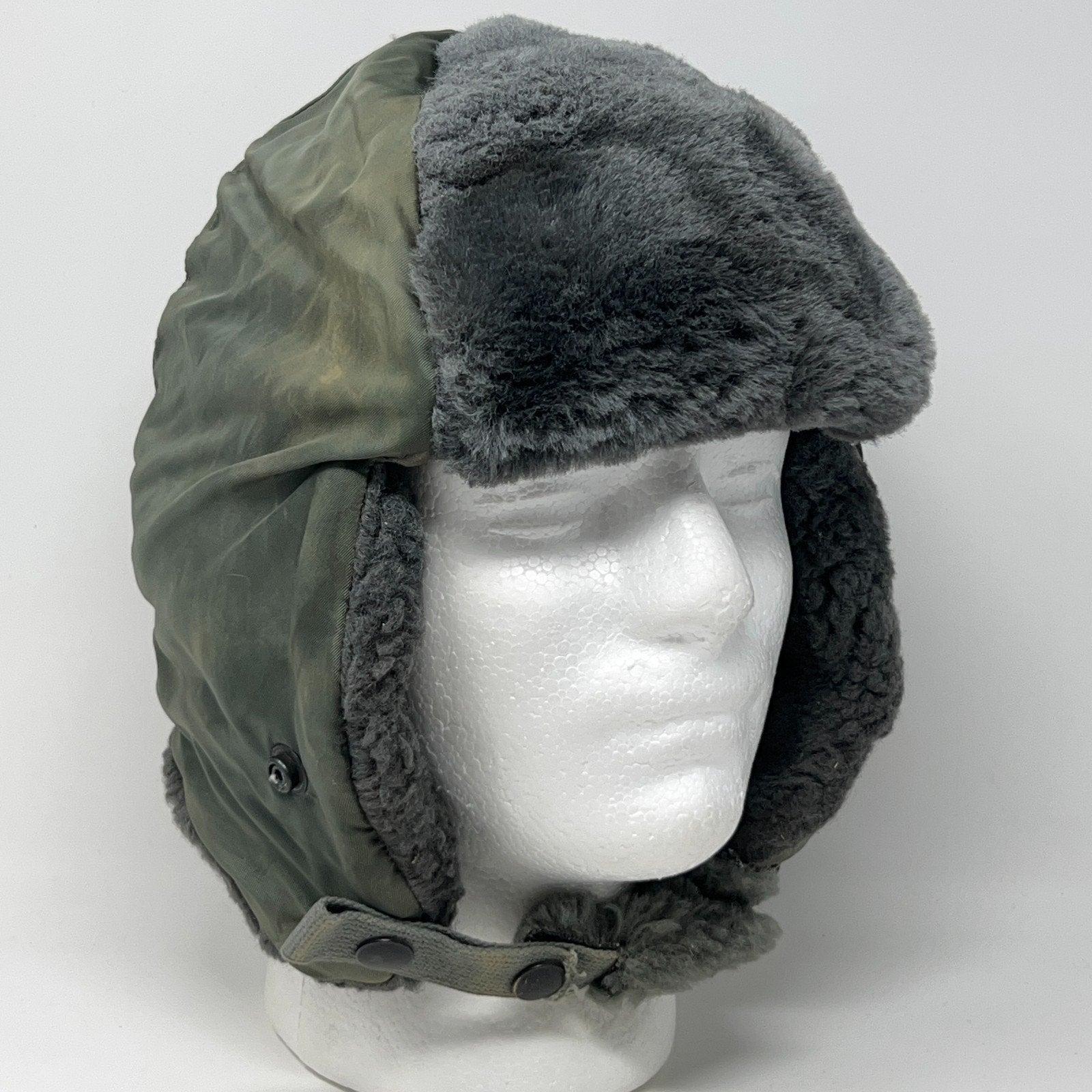 Vintage military helmet hat in green with fur trim, front view, one size fits all