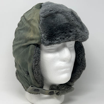 Vintage military helmet hat in green with fur trim, front view, one size fits all