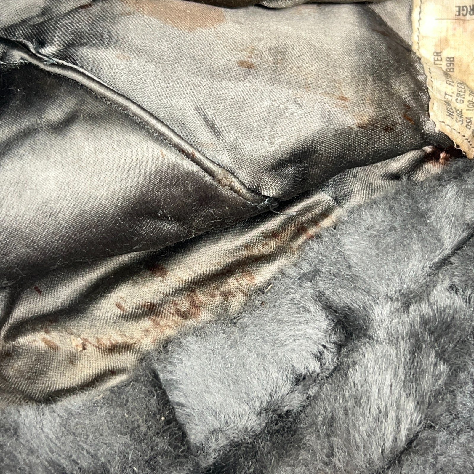 Vintage military helmet in black with a faded interior view