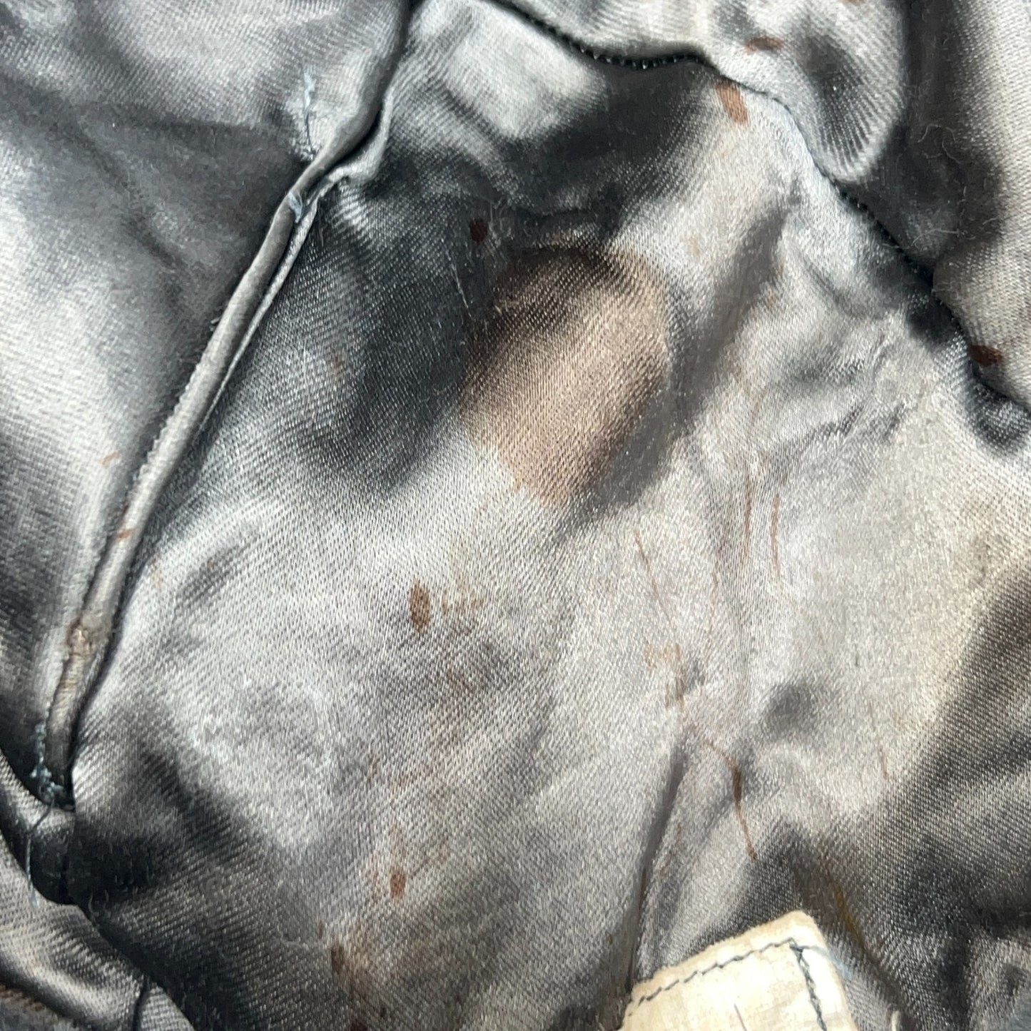 Vintage military helmet in black with a worn interior view