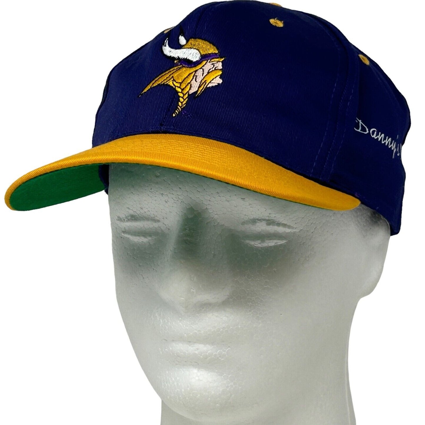 Minnesota Vikings navy blue hat with gold brim and front logo, featuring player name on the side
