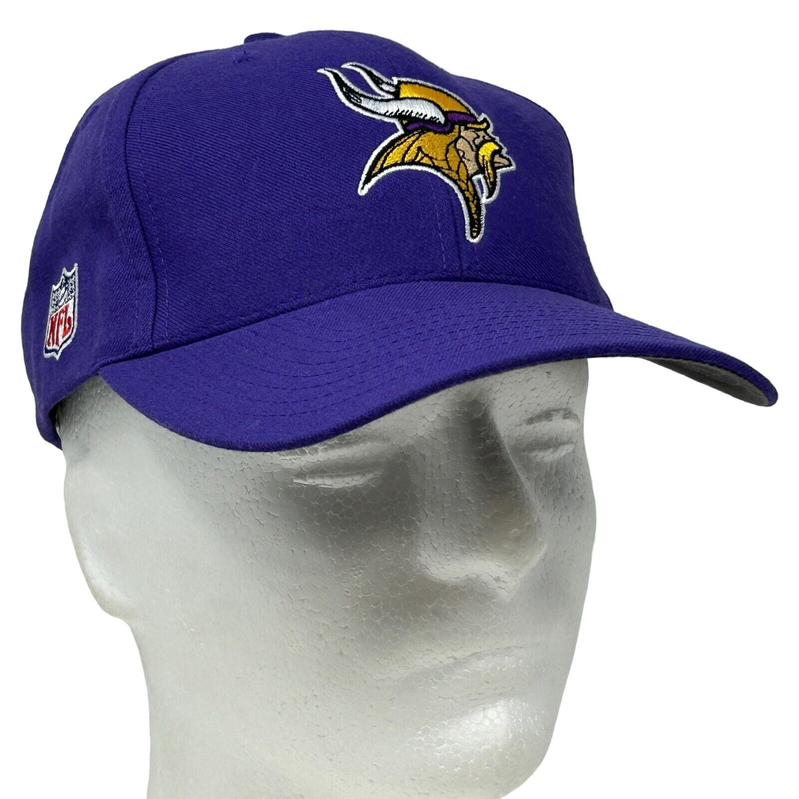 Minnesota Vikings purple baseball cap featuring logo embroidered on the front, side NFL emblem detail