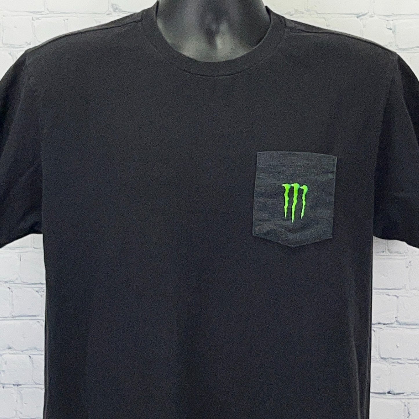 Black Monster Energy T-shirt with front pocket and green logo for casual wear