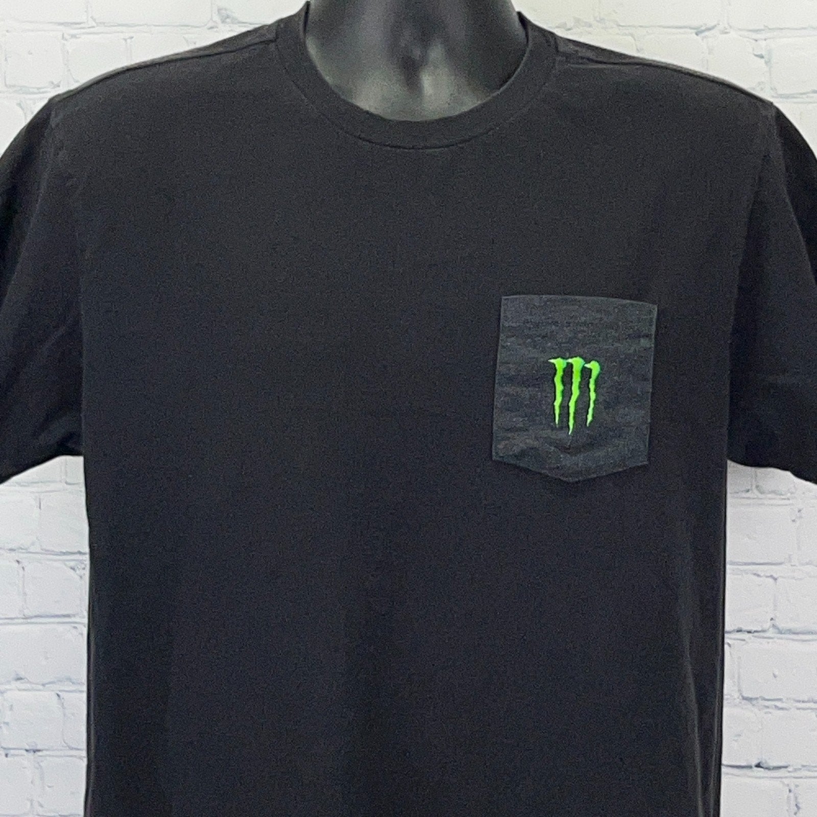 Black Monster Energy T-shirt with front pocket and green logo for casual wear