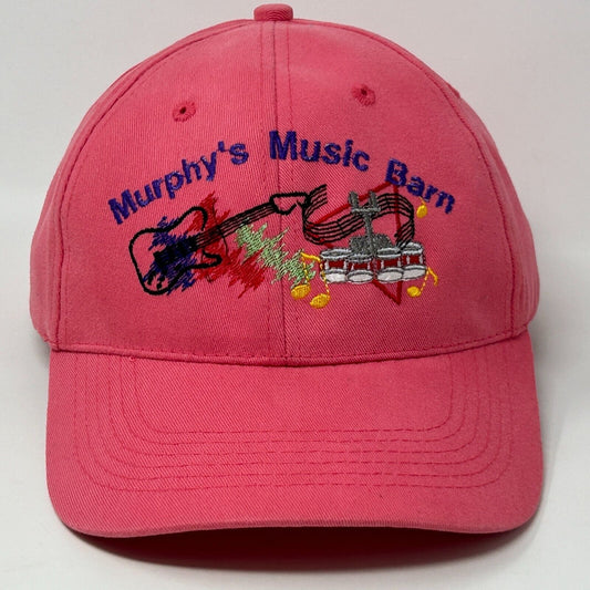 Pink cotton cap featuring embroidered logo of Murphys Music Barn with guitar design on the front