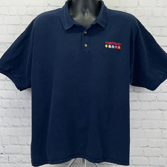 Gildan navy blue polo shirt, size 2XL, featuring a Namco Pac-Man logo on the chest