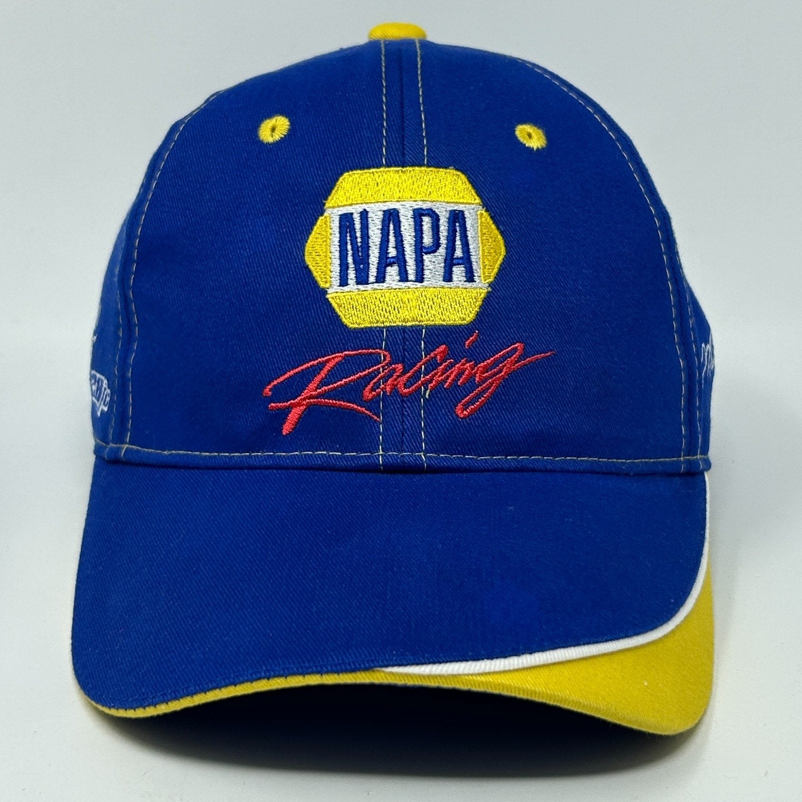 Front view of a blue NAPA Hat with yellow accents and embroidered NAPA Racing logo