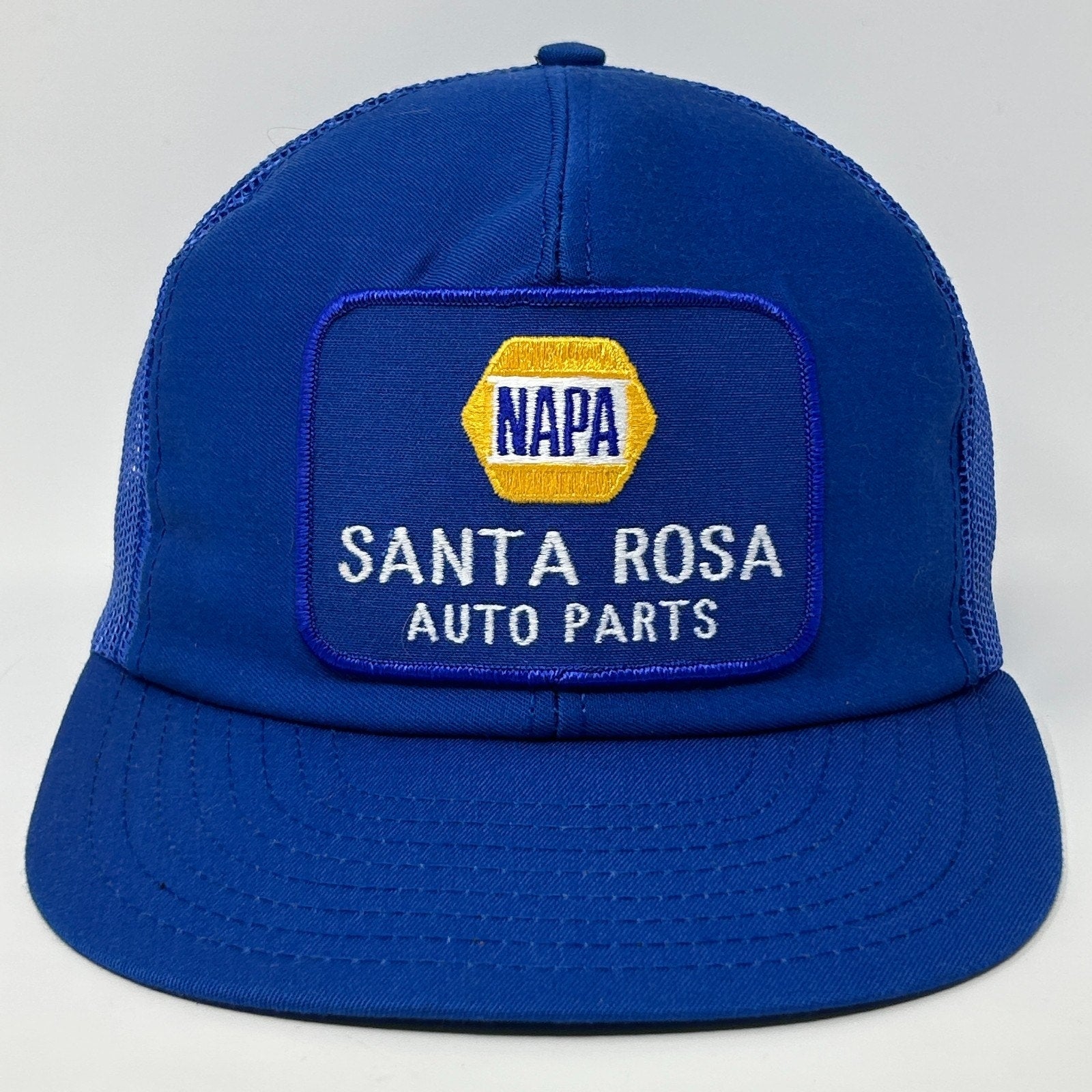 Vintage blue Trucker Hat Cap with embroidered NAPA Santa Rosa Auto Parts logo on the front