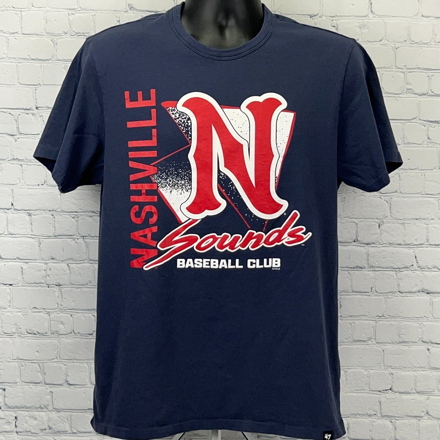 Navy blue Nashville Sounds T-shirt featuring a bold red logo with the team name and club detail