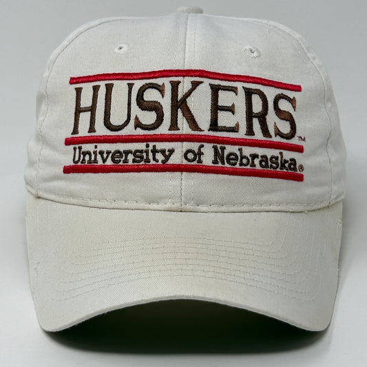 White Nebraska Cornhuskers cap featuring embroidered logo and text on the front