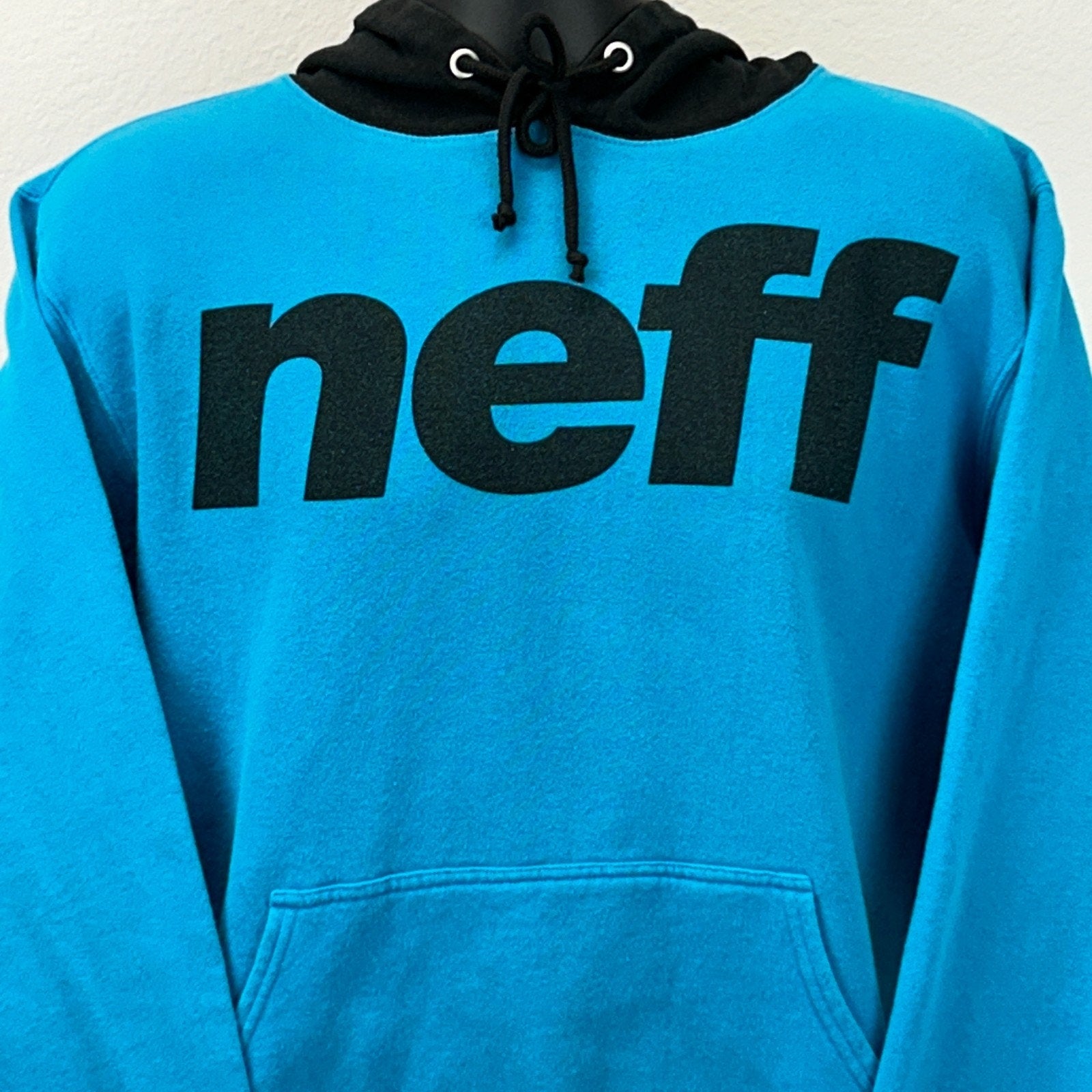 Front view of blue Neff Hoodie featuring large black neff logo and classic drawstring hood