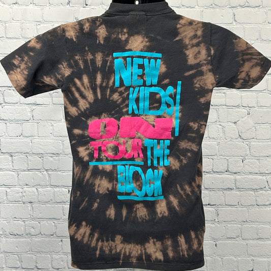 Back view of Hanes black tie-dye T-shirt featuring 'New Kids On The Block' graphic in vibrant colors