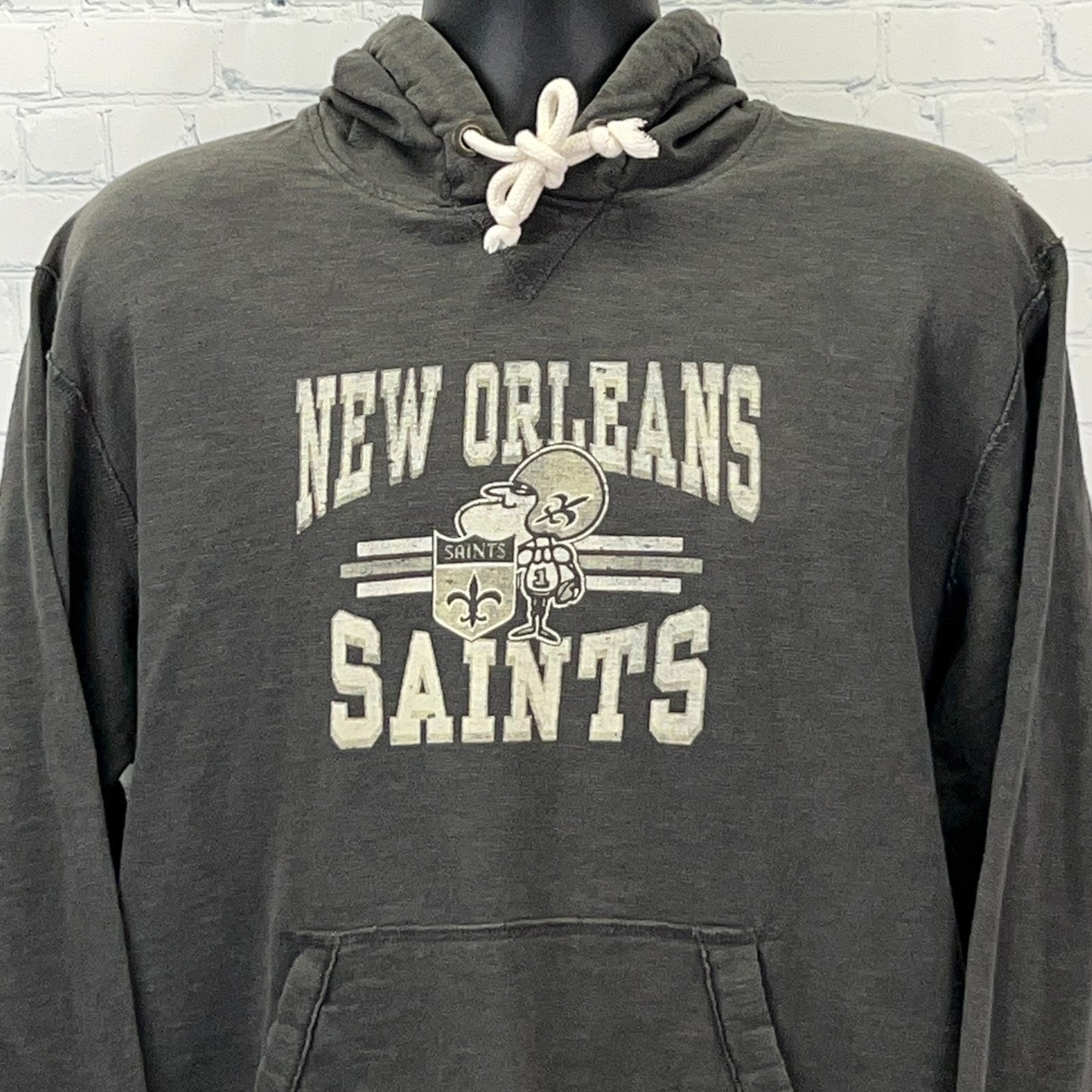 Charcoal New Orleans Saints hoodie featuring logo and front kangaroo pocket, perfect for fans