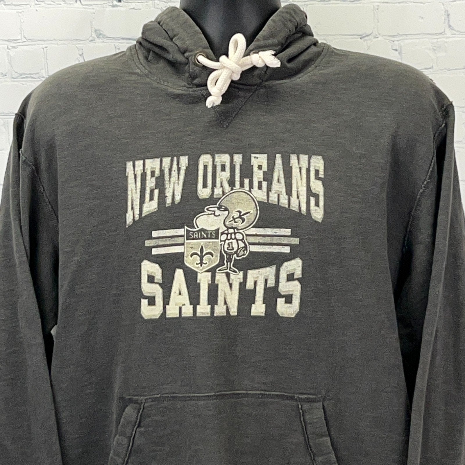 Charcoal New Orleans Saints hoodie featuring logo and front kangaroo pocket, perfect for fans