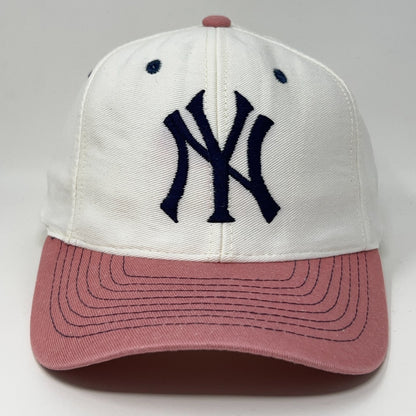 Vintage New York Yankees cap in white and pink featuring embroidered logo on the front