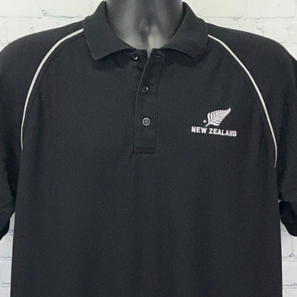 Black polo shirt from The Fern Brand with New Zealand All Blacks logo in front and contrast white stitching