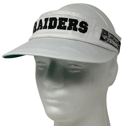 Gray Vintage Las Vegas Raiders visor hat with bold logo and adjustable strap, front view.