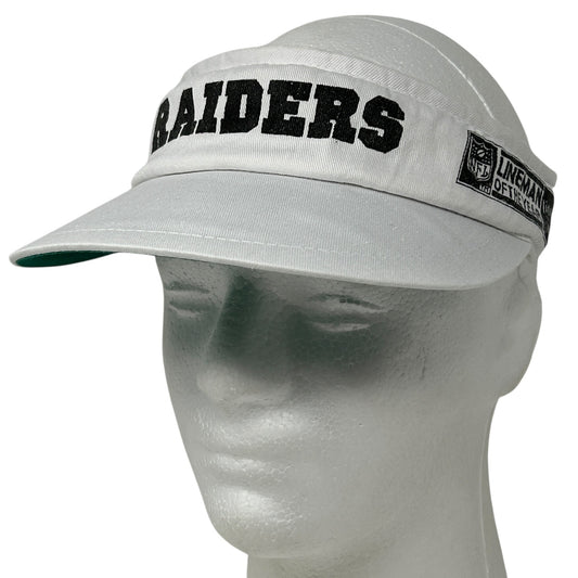 Gray Vintage Las Vegas Raiders visor hat with bold logo and adjustable strap, front view.