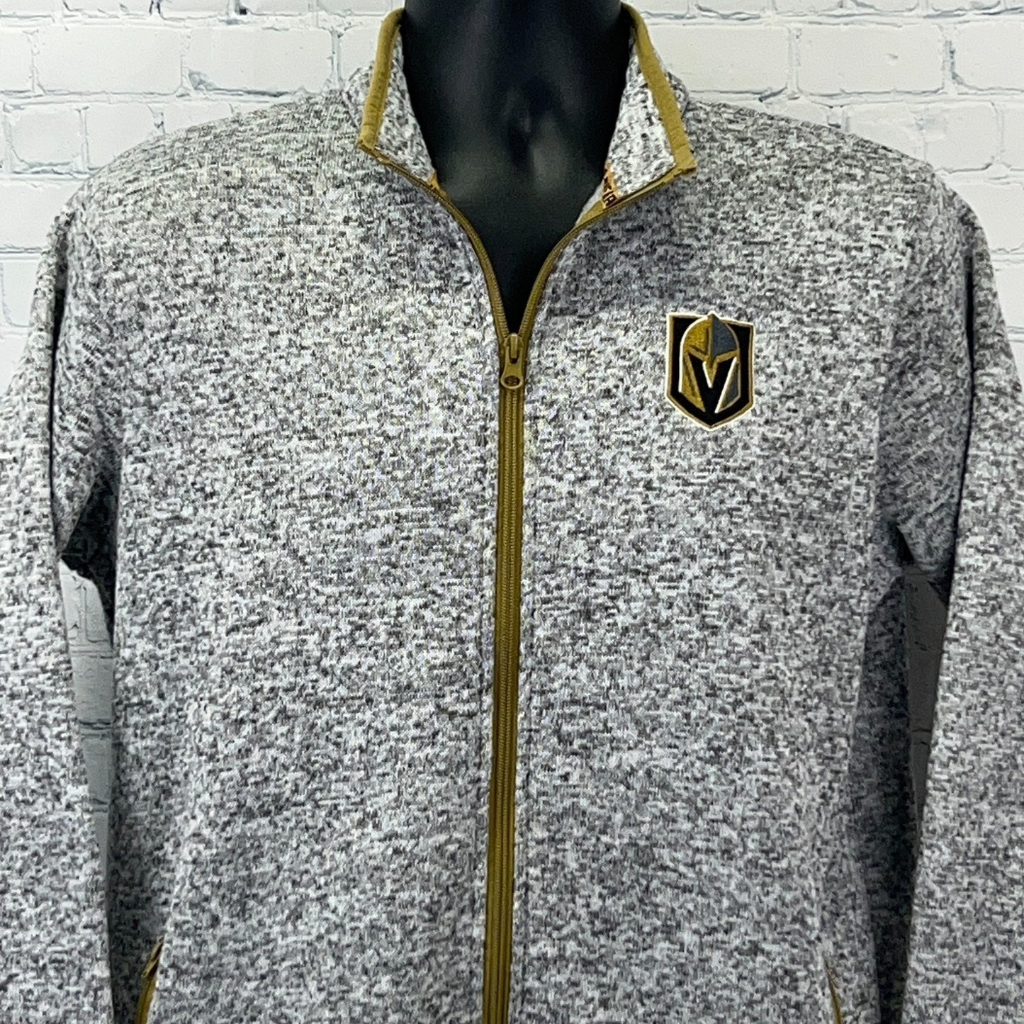 Gray zip-up jacket for men featuring Golden Knights logo on the chest and gold accents