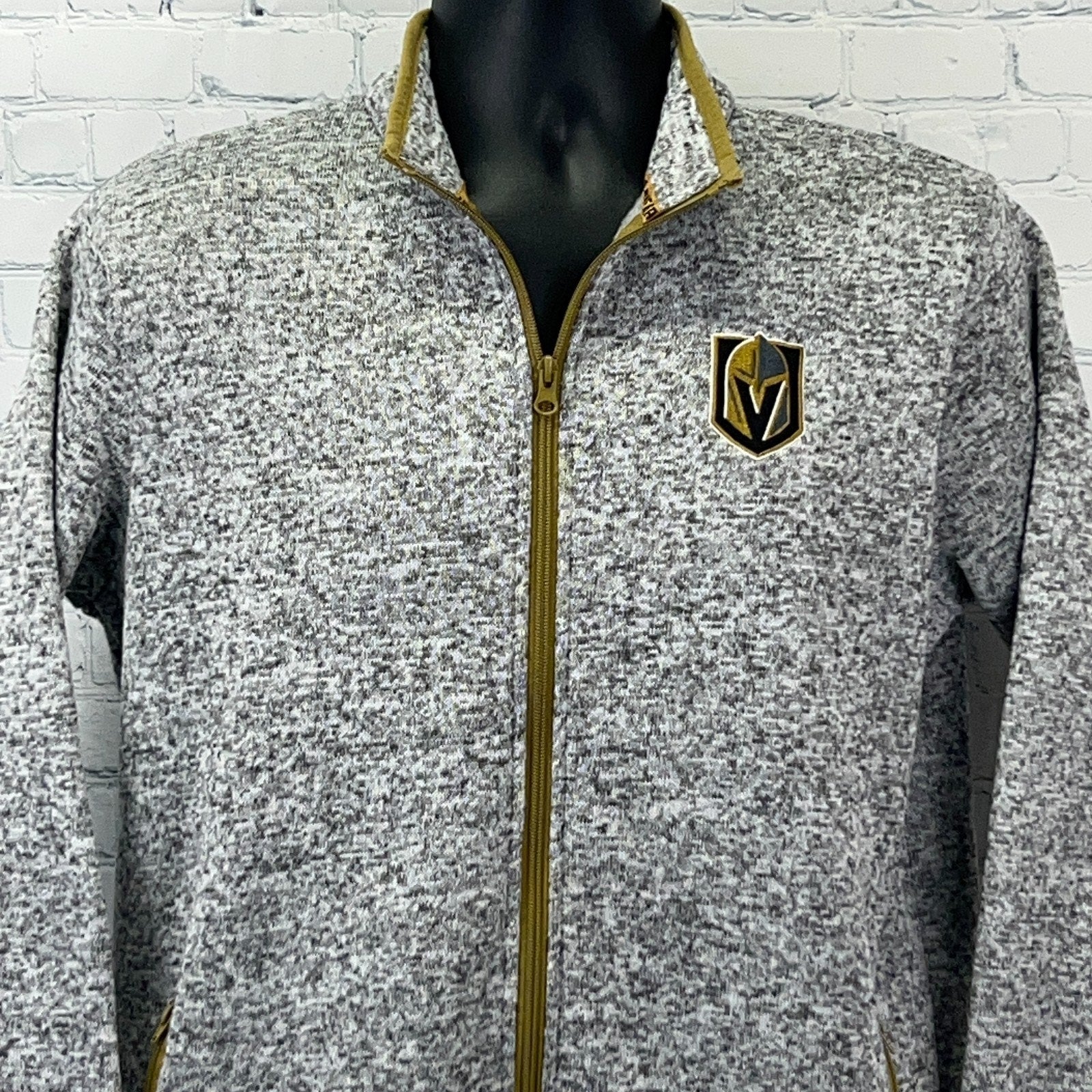 Gray zip-up jacket for men featuring Golden Knights logo on the chest and gold accents