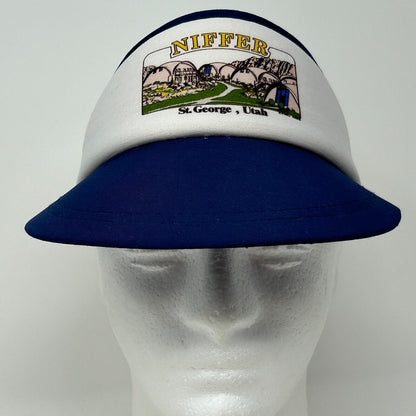 Vintage navy and white visor hat featuring St George Utah logo, showing front view with embroidered details