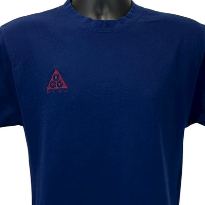 Navy Nike ACG T-Shirt in size medium with triangle logo on the front for outdoor enthusiasts