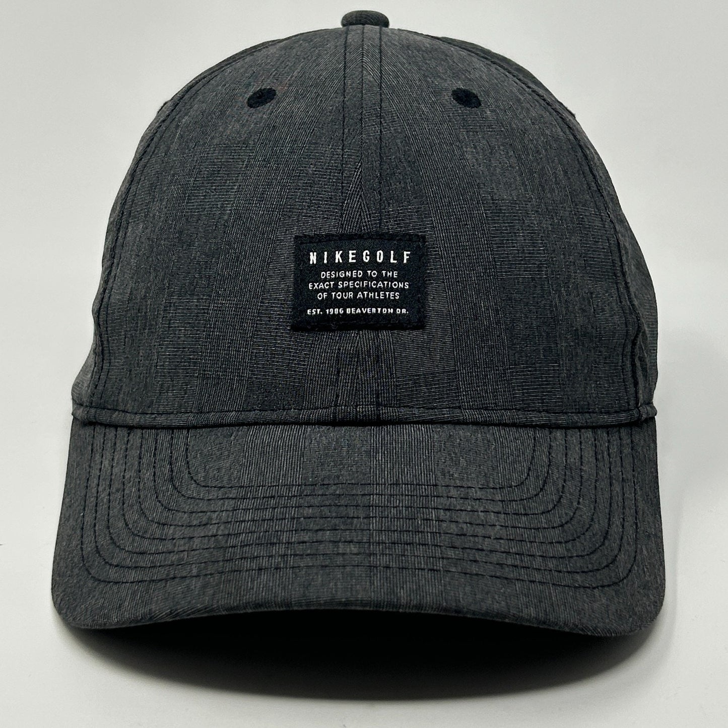 Nike Golf Hat in dark gray with front logo patch and curved brim for casual wear